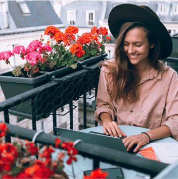 woman-on-balcony-with-flowers